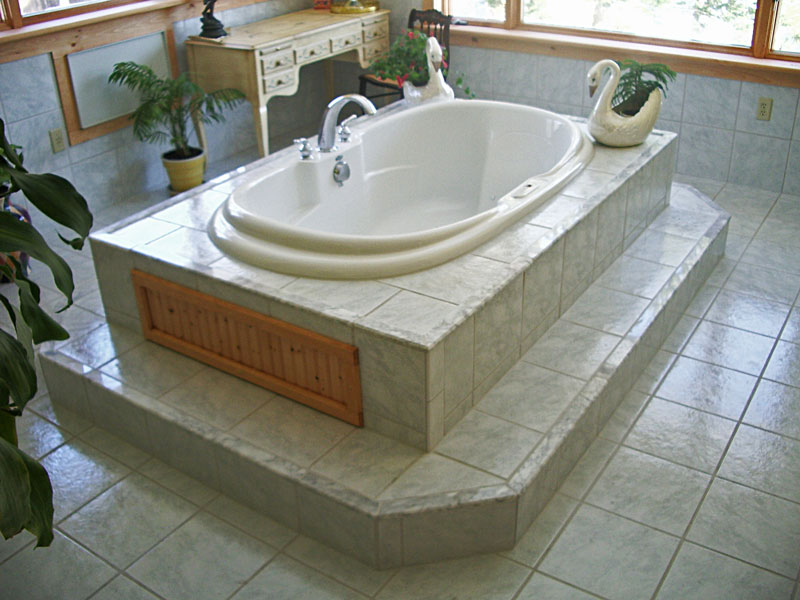 newly remodeled bathroom with large tub