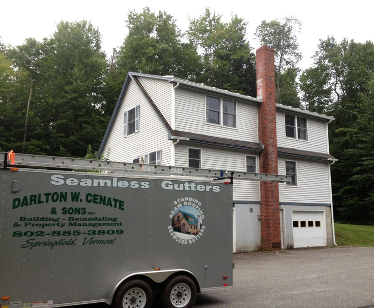 Darlton W Cenate & sons work truck out infront of a house